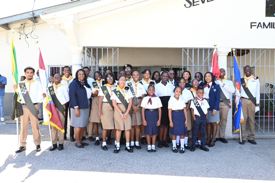 Pathfinder and Adventurer members outside the church